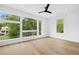 Spacious bedroom with hardwood floors, large windows, and a ceiling fan offers natural light and modern comfort at 1287 Star Ne Dr, Brookhaven, GA 30319