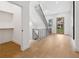 Entryway features light wood floors, a modern black metal staircase, and a view of the outdoors at 1287 Star Ne Dr, Brookhaven, GA 30319