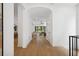 Hallway featuring light hardwood floors leading to an open living room and a view of the backyard at 1287 Star Ne Dr, Brookhaven, GA 30319