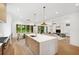 Open concept kitchen featuring a center island, modern appliances, and a breakfast nook overlooking the backyard at 1287 Star Ne Dr, Brookhaven, GA 30319