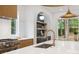 Close up of a modern kitchen island with a white countertop, stainless steel faucet, and high-end appliances at 1287 Star Ne Dr, Brookhaven, GA 30319