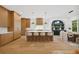 Spacious kitchen with an eat-in island, designer lighting, and a dining nook in the background at 1287 Star Ne Dr, Brookhaven, GA 30319