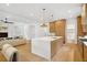 Bright, spacious kitchen with a large island, light wood cabinets, and modern lighting at 1287 Star Ne Dr, Brookhaven, GA 30319