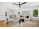 Bright living room featuring hardwood floors, minimalist decor, and large windows for natural light at 1287 Star Ne Dr, Brookhaven, GA 30319