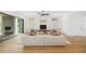 Spacious living room featuring hardwood floors, a modern fireplace, and large windows for natural light at 1287 Star Ne Dr, Brookhaven, GA 30319