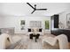 Stylish living room featuring minimalist decor, large windows, and sleek built-in cabinetry for modern living at 1287 Star Ne Dr, Brookhaven, GA 30319