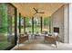 The backyard's covered patio features modern seating, an outdoor fireplace, and a view of the yard at 1287 Star Ne Dr, Brookhaven, GA 30319