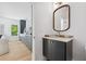 Stylish powder room with modern vanity, sleek mirror, and convenient access to living area at 1287 Star Ne Dr, Brookhaven, GA 30319