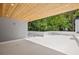 A contemporary rooftop deck features wooden ceilings, white walls, and views of the surrounding greenery at 1287 Star Ne Dr, Brookhaven, GA 30319