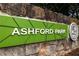 Ashford Park community sign on stone wall, showcasing the neighborhood's green design at 1287 Star Ne Dr, Brookhaven, GA 30319