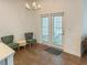 Cozy dining area filled with natural light has modern lighting and outdoor access at 150 Holden Way, Woodstock, GA 30189