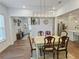 Hardwood floors extend from the dining area to the bright kitchen and living spaces at 150 Holden Way, Woodstock, GA 30189