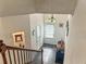 View of the foyer from the stairway to the main entrance, featuring a chandelier at 150 Holden Way, Woodstock, GA 30189