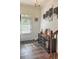 Inviting foyer features hardwood floors, staircase and an Atlanta-themed display at 150 Holden Way, Woodstock, GA 30189