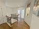 Open second floor hallway with hardwood floors and decorative niches at 150 Holden Way, Woodstock, GA 30189