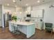 Bright kitchen features stainless steel appliances, large island, and plenty of cabinet space at 150 Holden Way, Woodstock, GA 30189