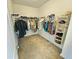 Spacious walk-in closet features ample hanging space and shelving for optimal organization of clothing and accessories at 150 Holden Way, Woodstock, GA 30189