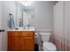 Cozy bathroom featuring a vanity with sink, toilet, and shower, providing functionality and comfort at 855 Mountain View Nw Ter, Marietta, GA 30064