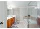 Bathroom featuring double sinks, a soaking tub, and a separate glass-enclosed shower at 855 Mountain View Nw Ter, Marietta, GA 30064