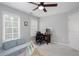Neutral bedroom with a ceiling fan, carpeted floors, and windows allowing for ample natural light at 855 Mountain View Nw Ter, Marietta, GA 30064