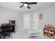 Neutral bedroom with a ceiling fan, carpeted floors, and windows allowing for ample natural light at 855 Mountain View Nw Ter, Marietta, GA 30064