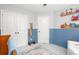 Bedroom featuring a crib, changing table, and comfortable seating, perfect for a new Gathering at 855 Mountain View Nw Ter, Marietta, GA 30064