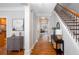 Entryway showcasing hardwood floors, staircase with black iron railing, and modern decor at 855 Mountain View Nw Ter, Marietta, GA 30064