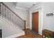 Inviting entryway with hardwood floors, staircase, and a decorative key holder at 855 Mountain View Nw Ter, Marietta, GA 30064