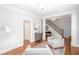 Bright living room with hardwood floors, two chairs, and neutral walls at 855 Mountain View Nw Ter, Marietta, GA 30064