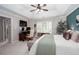 Bright main bedroom showcasing tray ceilings, an accent wall, and an office space at 855 Mountain View Nw Ter, Marietta, GA 30064