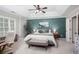 Spacious main bedroom with a king bed, tray ceiling, and paneled accent wall at 855 Mountain View Nw Ter, Marietta, GA 30064