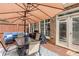Outdoor patio with stylish furnishings, dining area, and umbrella with privacy fencing at 855 Mountain View Nw Ter, Marietta, GA 30064