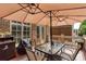 Outdoor patio with stylish furnishings, dining area, and umbrella, overlooking driveway at 855 Mountain View Nw Ter, Marietta, GA 30064