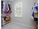 Walk-in closet with built-in shelving and racks, perfect for organizing clothes and shoes at 855 Mountain View Nw Ter, Marietta, GA 30064