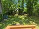 This home has a large backyard with lush landscaping, mature trees, and includes a storage shed at 112 Brown Se Ave, Atlanta, GA 30315
