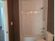 The bathroom features a shower/tub combo with white subway tile, modern fixtures, and a classic commode at 112 Brown Se Ave, Atlanta, GA 30315