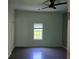 Comfortable bedroom with ceiling fan and a bright window at 112 Brown Se Ave, Atlanta, GA 30315