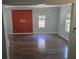Spacious living room with shiny hardwood floors and modern lighting at 112 Brown Se Ave, Atlanta, GA 30315