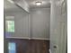 The living room is freshly painted with hardwood floors, baseboard and chair-rail molding at 112 Brown Se Ave, Atlanta, GA 30315