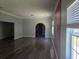 Bright living room featuring an archway and unique red accent wall at 112 Brown Se Ave, Atlanta, GA 30315