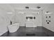 A luxurious bathroom with marble walls, soaking tub, and sleek black fixtures at 1410 Lavista Ne Rd, Atlanta, GA 30324