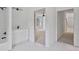 Stylish bathroom showcases marble tile, sleek vanity, and view to a bright, open room at 1410 Lavista Ne Rd, Atlanta, GA 30324