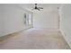 This airy room features a ceiling fan and a large window with views at 1410 Lavista Ne Rd, Atlanta, GA 30324