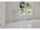 Bedroom with new floors and windows overlooking a wooded lot at 1410 Lavista Ne Rd, Atlanta, GA 30324