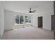 Spacious bedroom featuring three large windows and a modern ceiling fan at 1410 Lavista Ne Rd, Atlanta, GA 30324