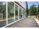 Exterior deck featuring wood flooring, cable railings and large glass doors to the interior at 1410 Lavista Ne Rd, Atlanta, GA 30324