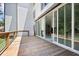 View of the wooden outdoor deck featuring glass doors to the interior of the home at 1410 Lavista Ne Rd, Atlanta, GA 30324