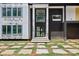 Home's entryway featuring black brick accents and a stone-paved front yard at 1410 Lavista Ne Rd, Atlanta, GA 30324