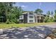 Street view of a modern two-story home with a black and white facade, complemented by a well-manicured lawn at 1410 Lavista Ne Rd, Atlanta, GA 30324