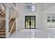 Spacious foyer with high ceilings, a modern staircase, and large windows for ample natural light at 1410 Lavista Ne Rd, Atlanta, GA 30324